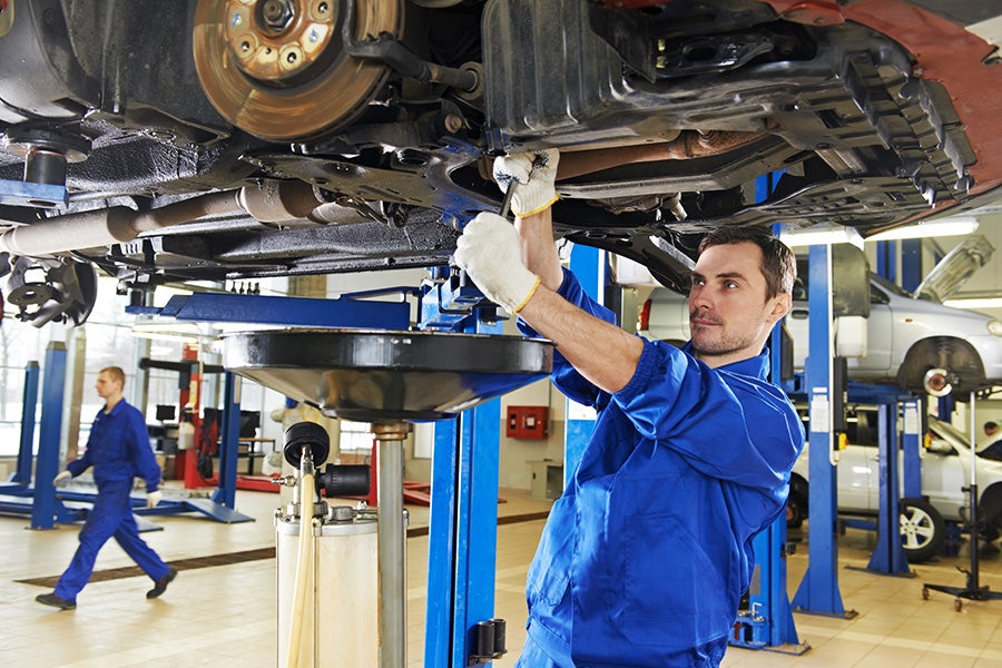mechanic changing oil at the Criswell Chevrolet Gaithersburg dealership